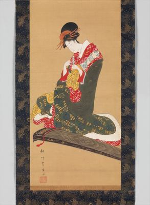 A woman about to play the koto
